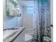 Bright bathroom with a shower/tub combo and decorative accents at 3478 Gum Dr, Weeki Wachee, FL 34607