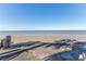 Beachfront view with calm water and palm tree shadows at 3478 Gum Dr, Weeki Wachee, FL 34607