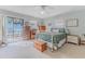 Relaxing bedroom featuring a comfy bed and private balcony access at 3478 Gum Dr, Weeki Wachee, FL 34607