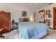 Guest bedroom with double bed, wooden armoire, and charming decor at 3478 Gum Dr, Weeki Wachee, FL 34607