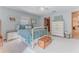 Charming bedroom with a metal bed frame and vintage dresser at 3478 Gum Dr, Weeki Wachee, FL 34607