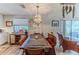 Rustic dining room with a unique wooden table and chandelier at 3478 Gum Dr, Weeki Wachee, FL 34607
