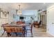 Open dining area with rustic farmhouse table and view into living room at 3478 Gum Dr, Weeki Wachee, FL 34607