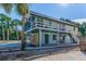 Two-story house with large deck and tropical landscaping at 3478 Gum Dr, Weeki Wachee, FL 34607