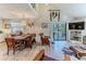Spacious living area with hardwood floors and access to a deck at 3478 Gum Dr, Weeki Wachee, FL 34607