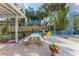Outdoor patio with picnic table and colorful chairs at 3478 Gum Dr, Weeki Wachee, FL 34607