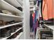 Walk-in closet with shelving and hanging space for shoes and clothes at 4316 Cairoli Ct, Wesley Chapel, FL 33543