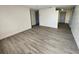 Spacious living area showcasing light gray vinyl plank flooring at 4605 Irene Loop, New Port Richey, FL 34652