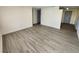 Spacious living area showcasing light gray vinyl plank flooring at 4605 Irene Loop, New Port Richey, FL 34652