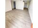 Spacious living area showcasing light gray vinyl plank flooring at 4605 Irene Loop, New Port Richey, FL 34652