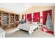 Large bedroom with built-in shelving and sitting area at 4909 Sylvan Oaks Dr, Valrico, FL 33596