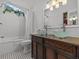 Bathroom with double sinks and a walk-in shower at 514 Wideview Ave, Tarpon Springs, FL 34689