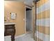 Bathroom with a dark wood vanity and a shower/tub combo at 514 Wideview Ave, Tarpon Springs, FL 34689