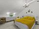 Serene bedroom featuring a mustard yellow comforter and white accents at 514 Wideview Ave, Tarpon Springs, FL 34689