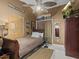 Small bedroom with a wooden sleigh bed and ceiling fan at 514 Wideview Ave, Tarpon Springs, FL 34689