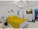 Bright bedroom with a yellow comforter and white dresser at 514 Wideview Ave, Tarpon Springs, FL 34689