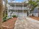 Two-story house with a double garage and a large front porch at 514 Wideview Ave, Tarpon Springs, FL 34689