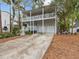 Two-story house with double garage and a spacious front porch at 514 Wideview Ave, Tarpon Springs, FL 34689