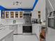 Modern kitchen with stainless steel appliances and white cabinetry at 514 Wideview Ave, Tarpon Springs, FL 34689
