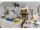 Living room features hardwood floors, a fireplace, and white sofas at 514 Wideview Ave, Tarpon Springs, FL 34689
