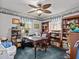 Home office with built-in bookshelves and a large desk at 514 Wideview Ave, Tarpon Springs, FL 34689