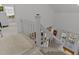 View from the top of the stairs, showing the living area below at 514 Wideview Ave, Tarpon Springs, FL 34689