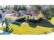 Aerial view of house with palm tree and yard at 5215 New Brittany Ln, Zephyrhills, FL 33541