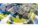 Single-Gathering home with driveway and landscaped lawn, viewed from above at 5215 New Brittany Ln, Zephyrhills, FL 33541