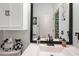 Simple bathroom with single vanity and built in storage at 5215 New Brittany Ln, Zephyrhills, FL 33541