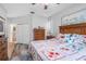 Bright bedroom with ensuite bathroom access and large bed at 5215 New Brittany Ln, Zephyrhills, FL 33541