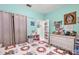 Charming bedroom with floral bedding and white dresser at 5215 New Brittany Ln, Zephyrhills, FL 33541