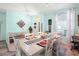 Bright dining room with a farmhouse table and seating for six at 5215 New Brittany Ln, Zephyrhills, FL 33541