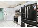 Modern kitchen with stainless steel appliances and white cabinets at 5215 New Brittany Ln, Zephyrhills, FL 33541