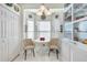 Charming kitchen nook with a round table and two chairs at 5215 New Brittany Ln, Zephyrhills, FL 33541