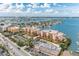 Waterfront community with building, parking, and nearby businesses at 5301 Gulf Blvd # E202, St Pete Beach, FL 33706