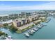 Stunning aerial view of waterfront condos with boat slips at 5301 Gulf Blvd # E202, St Pete Beach, FL 33706