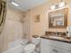 Bathroom with a bathtub, toilet, and granite vanity at 5301 Gulf Blvd # E202, St Pete Beach, FL 33706