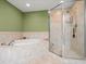Spa-like bathroom with a soaking tub and shower at 5301 Gulf Blvd # E202, St Pete Beach, FL 33706