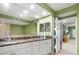 Bathroom with double vanity and a walk-in shower at 5301 Gulf Blvd # E202, St Pete Beach, FL 33706