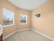 Empty bedroom with two windows at 5301 Gulf Blvd # E202, St Pete Beach, FL 33706