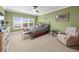 Spacious bedroom with a ceiling fan and ample natural light at 5301 Gulf Blvd # E202, St Pete Beach, FL 33706