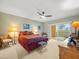 Spacious bedroom with balcony access and ceiling fan at 5301 Gulf Blvd # E202, St Pete Beach, FL 33706