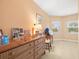 Small bedroom with dresser and window at 5301 Gulf Blvd # E202, St Pete Beach, FL 33706