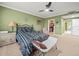 Main bedroom with a comfortable sitting area and walk-in closet at 5301 Gulf Blvd # E202, St Pete Beach, FL 33706