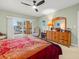 Bright bedroom with ensuite dresser and balcony access at 5301 Gulf Blvd # E202, St Pete Beach, FL 33706