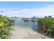 Private dock with boat slips and direct water access; sandy beach at 5301 Gulf Blvd # E202, St Pete Beach, FL 33706