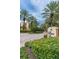 Gated entrance to Boca Sands with lush landscaping at 5301 Gulf Blvd # E202, St Pete Beach, FL 33706