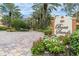 Community entrance with landscaping and signage at 5301 Gulf Blvd # E202, St Pete Beach, FL 33706