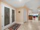 Elegant entryway with double doors and tile flooring at 5301 Gulf Blvd # E202, St Pete Beach, FL 33706