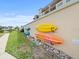 Convenient kayak and paddleboard storage on building exterior at 5301 Gulf Blvd # E202, St Pete Beach, FL 33706